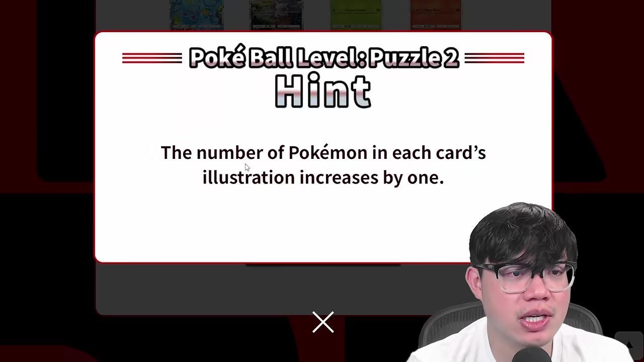 A large white hint popup for Poké Ball Level Puzzle 2 says that the number of Pokémon in each card’s illustration increases by one.
