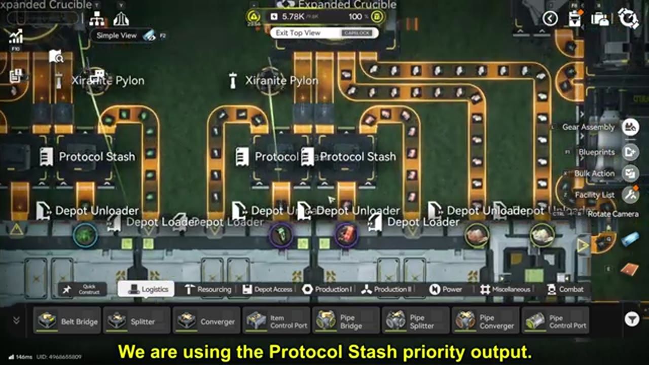 A top-down factory layout shows multiple Protocol Stash units, depot loaders and unloaders, and orange item belts routed around an expanded crucible.